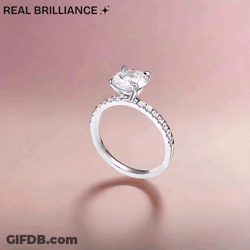A Picture Of A Diamond Ring With The Words Mr. & Mrs. GIF