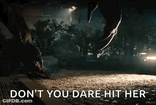 A Picture Of A Dinosaur With The Words " Do N't You Dare Hit Her " On It GIF