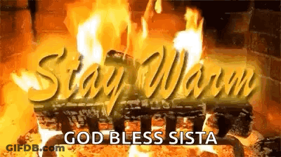 A Picture Of A Fireplace With The Words `` Stay Warm '' And `` God Bless Sista '' Written On It . GIF