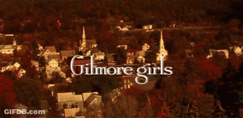A Picture Of A Forest With The Words Gilmore Girls Written In White GIF