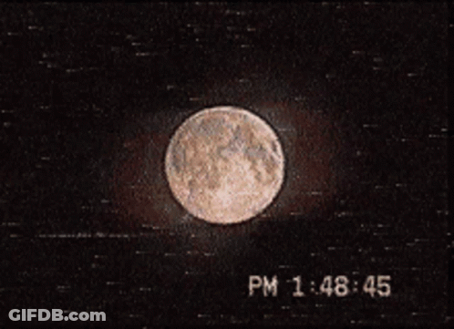A Picture Of A Full Moon With The Time Of 1:48 45 GIF