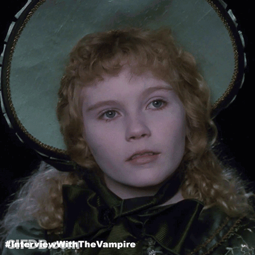 A Picture Of A Girl With #Interviewwiththevampire Written Below It GIF
