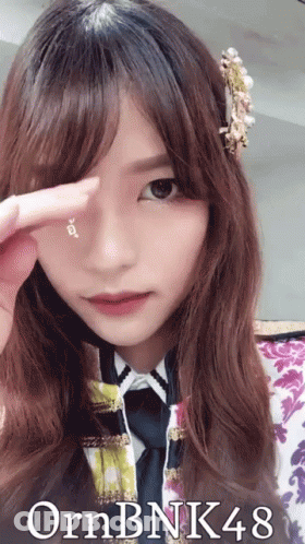 A Picture Of A Girl With The Name Ornbnk48 GIF