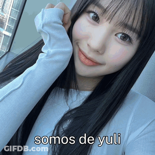 A Picture Of A Girl With The Words Somos De Yuli On The Bottom GIF