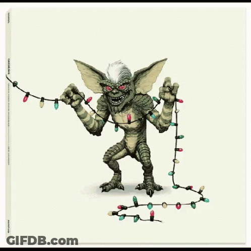 A Picture Of A Gremlin Holding A String Of Lights GIF