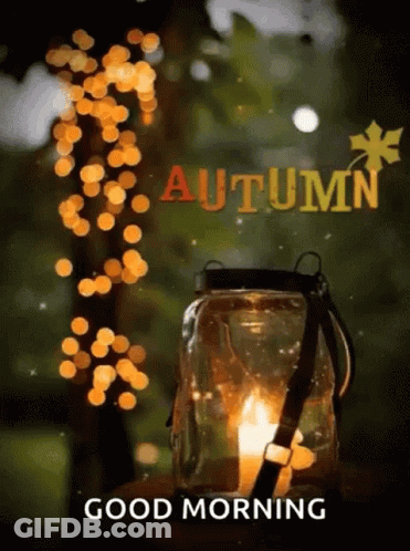 A Picture Of A Lantern With A Candle In It And The Words `` Good Morning Autumn '' . GIF