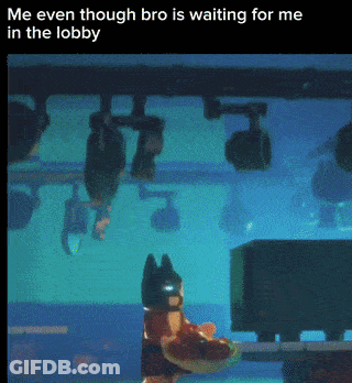A Picture Of A Lego Batman Standing In A Lobby With The Caption " Me Even Though Bro Is Waiting For Me In The Lobby " GIF