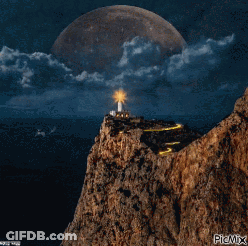 A Picture Of A Lighthouse On Top Of A Rocky Hill With A Full Moon Behind It GIF