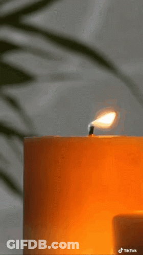 A Picture Of A Lit Candle With The Words My B On It GIF