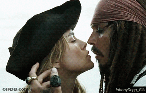 A Picture Of A Man And A Woman Kissing With The Caption Johnnydepp GIF