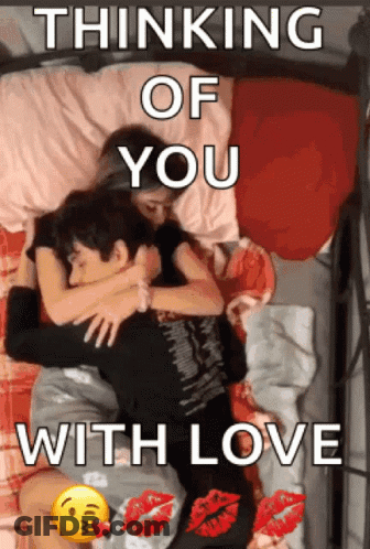 A Picture Of A Man And Woman Hugging With The Words Thinking Of You With Love GIF