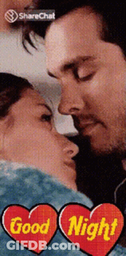 A Picture Of A Man And Woman Kissing With The Words Good Night In The Corner GIF