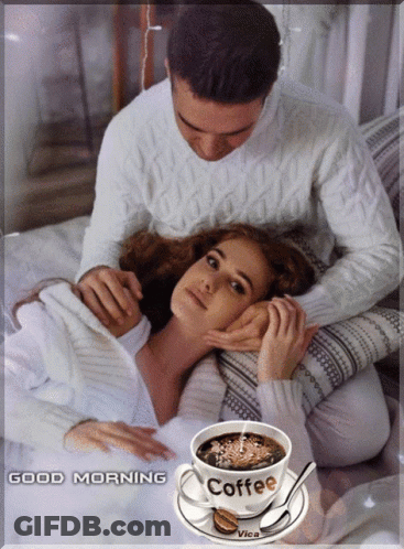A Picture Of A Man And Woman With A Cup Of Coffee That Says Coffee On It GIF