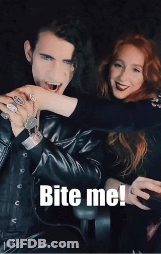 A Picture Of A Man Biting A Woman 'S Hand With The Words Bite Me Below It GIF