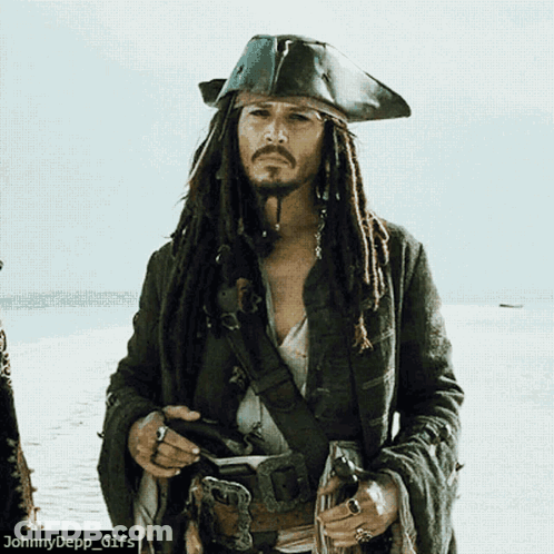 A Picture Of A Man Dressed As A Pirate With Dreadlocks GIF