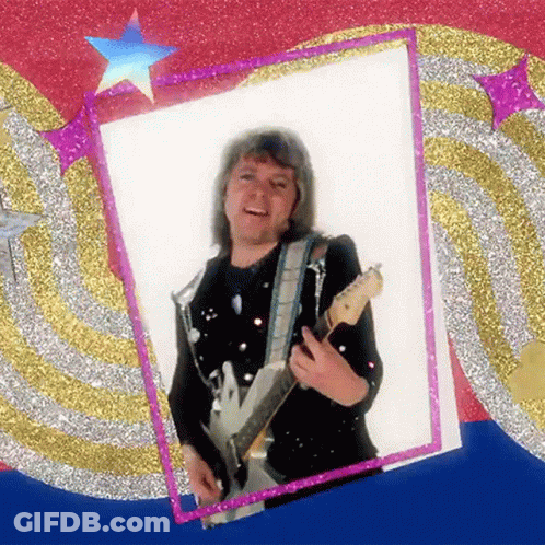 A Picture Of A Man Holding A Guitar In Front Of A Glittery Background GIF