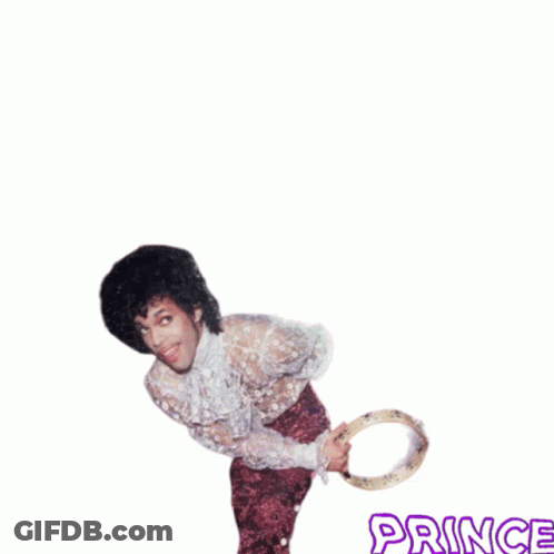A Picture Of A Man Holding A Tambourine With The Word Prince On The Bottom GIF