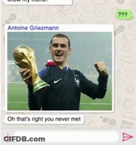 A Picture Of A Man Holding A Trophy With The Name Antoine Griezmann At The Top GIF