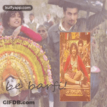 A Picture Of A Man Holding An Umbrella With The Words Be Barfi On The Bottom GIF