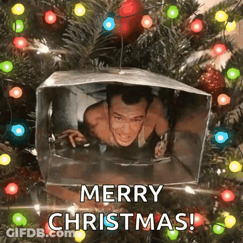 A Picture Of A Man In A Box With The Words Merry Christmas GIF