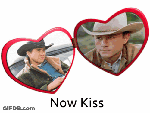 A Picture Of A Man In A Cowboy Hat With The Words " Now Kiss " Below It GIF