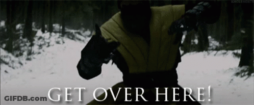 A Picture Of A Man In A Forest With The Words Get Over Here GIF