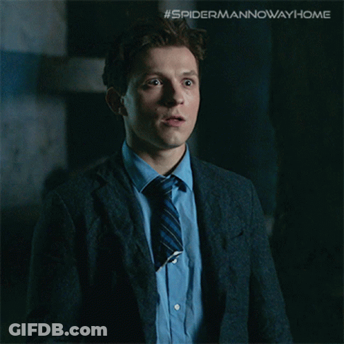 A Picture Of A Man In A Suit And Tie With The Caption " The Multiverse Is Real " GIF