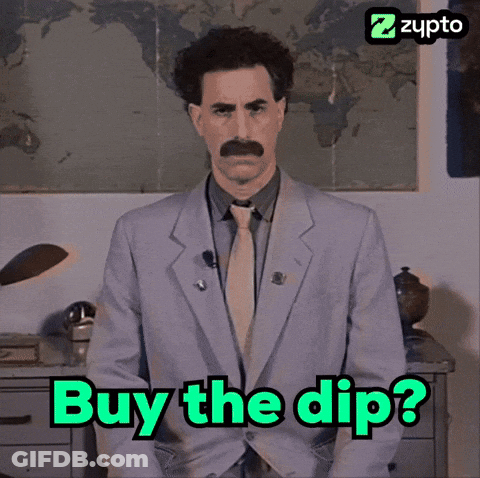 A Picture Of A Man In A Suit And Tie With The Words Buy The Dip GIF