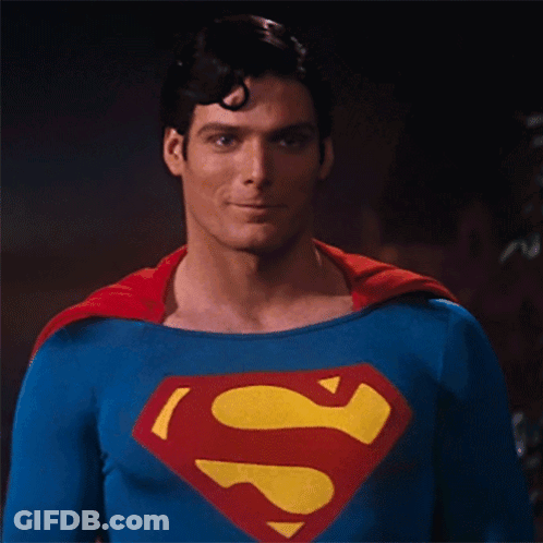 A Picture Of A Man In A Superman Costume With The Words " You Okay " Below Him GIF
