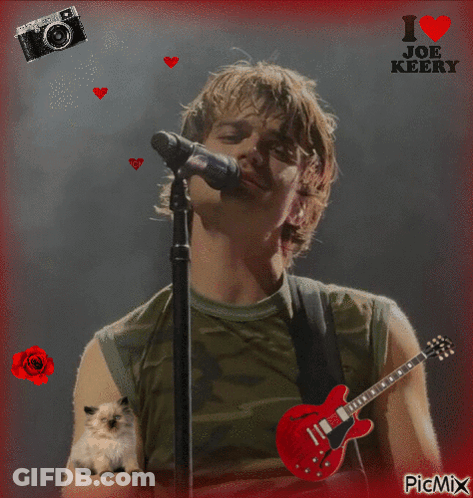 A Picture Of A Man Singing Into A Microphone With The Words I Love Joe Keers On The Top GIF