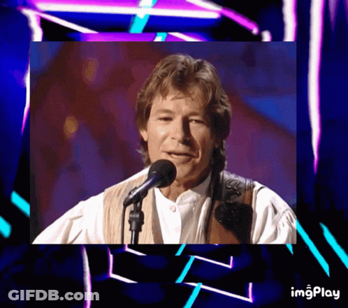 A Picture Of A Man Singing Into A Microphone With The Words Imgplay Below It GIF