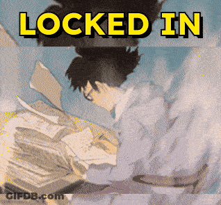 A Picture Of A Man Sitting At A Desk With The Words Locked In GIF