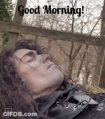 A Picture Of A Man Sleeping With The Words Good Morning GIF