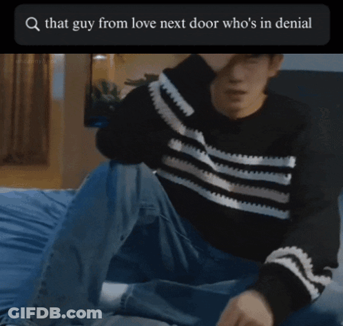 A Picture Of A Man Standing In Front Of A Bed With The Words That Guy From Love Next Door Who 'S In Denial At The Top GIF