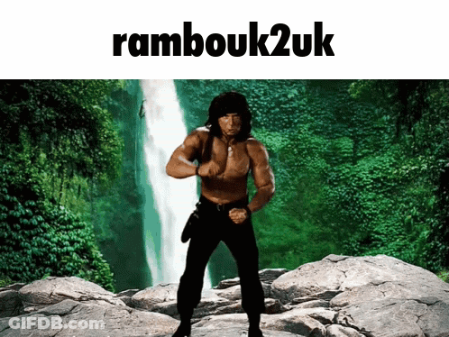 A Picture Of A Man Standing In Front Of A Waterfall With The Words " Rambouk2uk " Above Him GIF