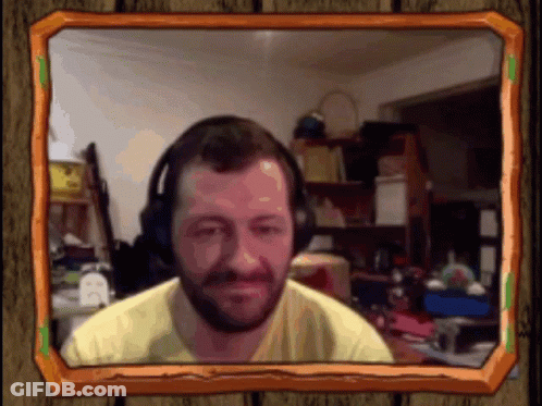 A Picture Of A Man Wearing Headphones And A Yellow Shirt In A Wooden Frame GIF