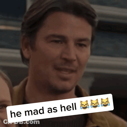 A Picture Of A Man With A Caption That Reads He Mad As Hell GIF