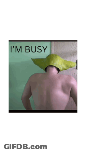 A Picture Of A Man With A Green Hat That Says I 'M Busy On The Bottom GIF