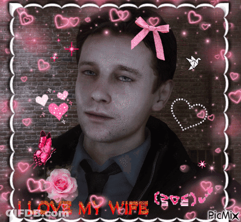 A Picture Of A Man With A Pink Bow On His Head And The Words " I Love My Wife " GIF