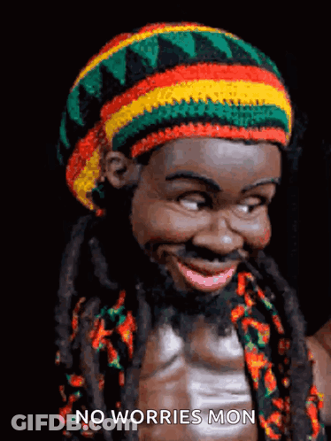 A Picture Of A Man With Dreadlocks And A Hat That Says " No Worries Mon " On It GIF