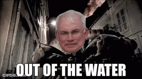 A Picture Of A Man With Glasses And The Words Out Of The Water Below Him GIF