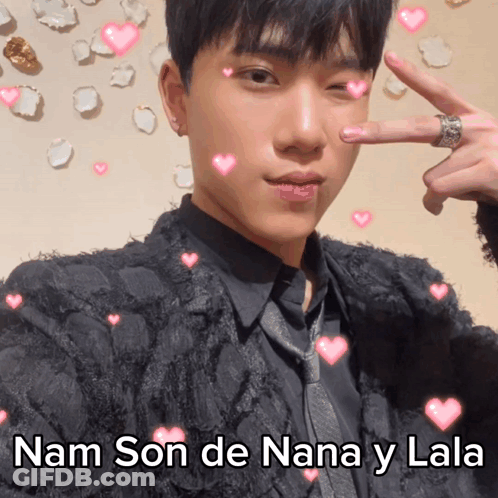 A Picture Of A Man With Hearts Around Him And The Words Nam Son De Nana Y Lala GIF
