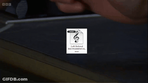 A Picture Of A Man With Long Hair And A Beard Is Behind A BBC Logo GIF
