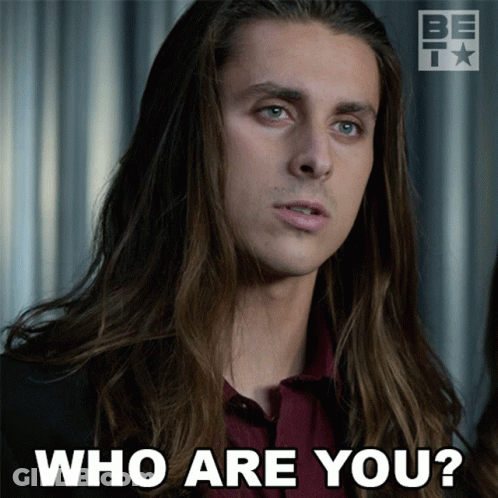 A Picture Of A Man With Long Hair Asking " Who Are You " GIF
