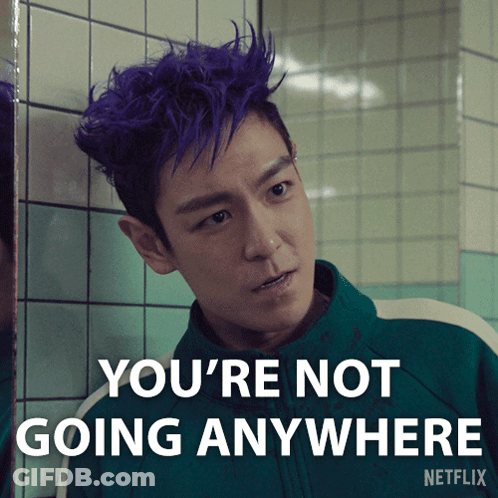A Picture Of A Man With Purple Hair And The Words You 'Re Not Going Anywhere GIF