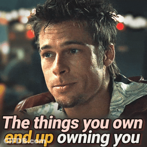 A Picture Of A Man With The Words " The Things You Own End Up Owning You " Below Him GIF