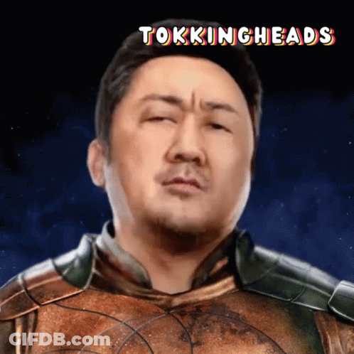 A Picture Of A Man With The Words Tokingheads Written Above Him GIF