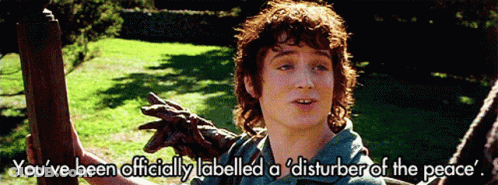 A Picture Of A Man With The Words " You 'Ve Been Officially Labelled A Disturber Of The Peace " Above Him GIF