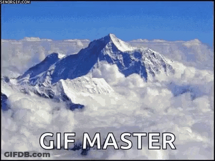 A Picture Of A Mountain Covered In Snow And Clouds With The Words Gif Master Below It GIF