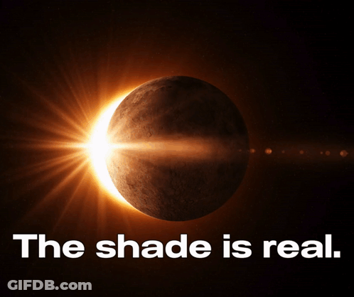 A Picture Of A Partial Eclipse With The Words " The Shade Is Real " Below It GIF
